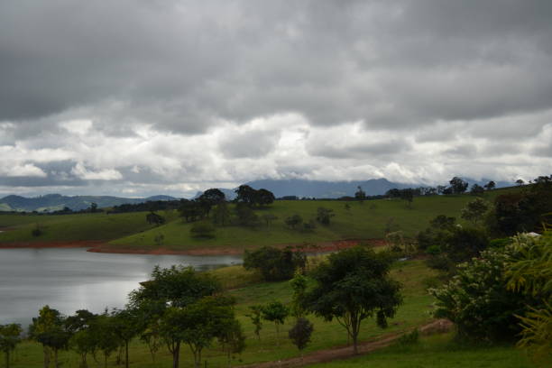 Great view of the lake from the Piracaia dam on a cloudy afternoon. The photo was taken after a heavy raining day.